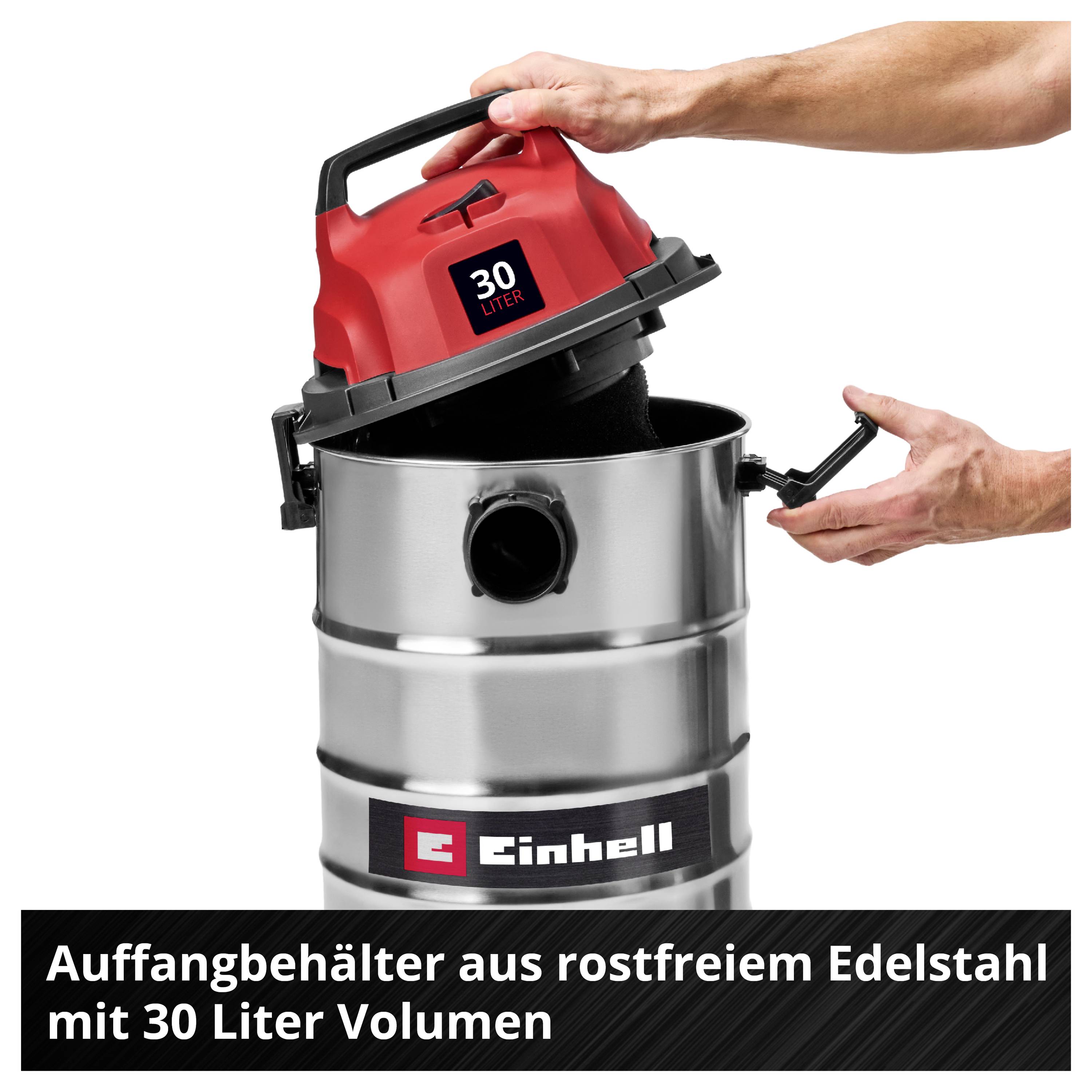 Aspirateur 'Einhell' avec réservoir en acier inoxydable, capacité de 30 litres, une main tenant le couvercle rouge avec le moteur.