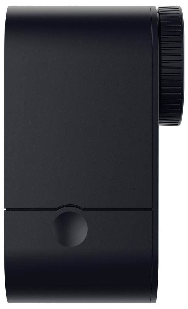 Un appareil électronique noir rectangulaire avec un cadran circulaire sur le côté droit. L'appareil présente un design minimaliste et semble compact.