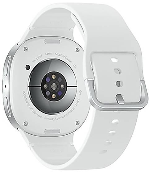 L'arrière d'une montre intelligente blanche montrant un capteur de fréquence cardiaque et des contacts de charge, avec une sangle lisse et une boucle en métal.