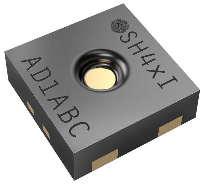 Un petit capteur électronique noir étiqueté « SH4XI » et « AD1ABC » avec une ouverture circulaire centrale, présentant des contacts métalliques sur les côtés.