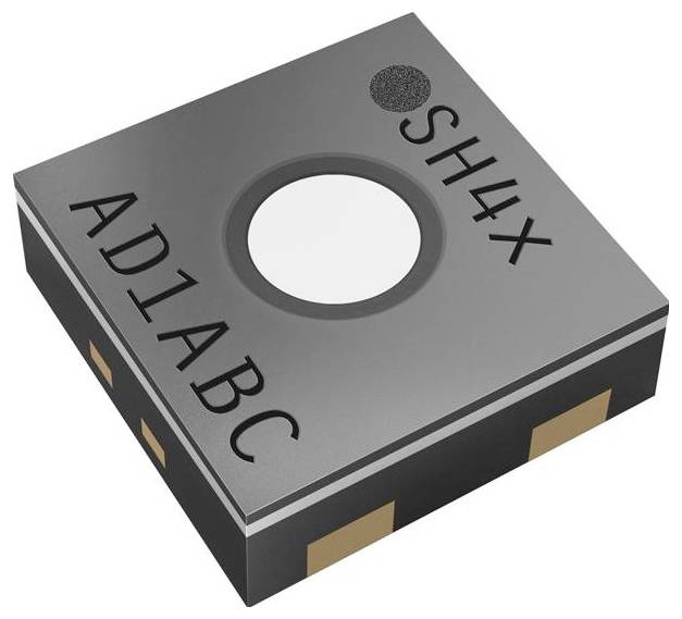 Un petit capteur électronique carré étiqueté « AD1ABC » et « SH4X », présentant un composant central circulaire, probablement destiné à la détection lumineuse ou à d'autres fonctions de détection.