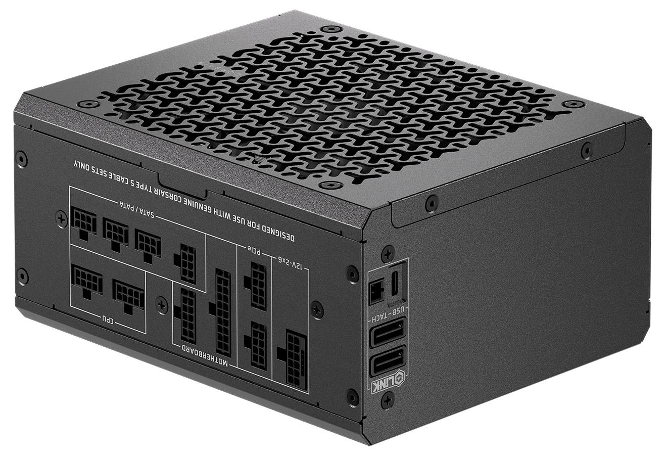 Un bloc d'alimentation informatique doté de plusieurs connecteurs sur un côté, avec un dessus ventilé pour la circulation d'air, et portant des marquages indiquant différents ports de connexion.