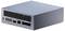 Un ordinateur compact et élégant doté de plusieurs ports sur son côté, comprenant USB-C, HDMI et Ethernet, reposant sur une surface plane.