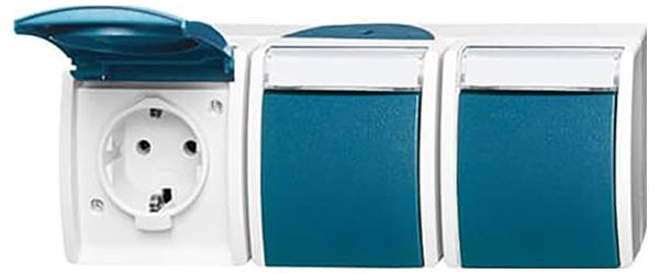 Un capteur de mouvement blanc montè sur le mur avec une zone de capteur central légèrement saillante, utilisé pour détecter les mouvements dans une pièce.