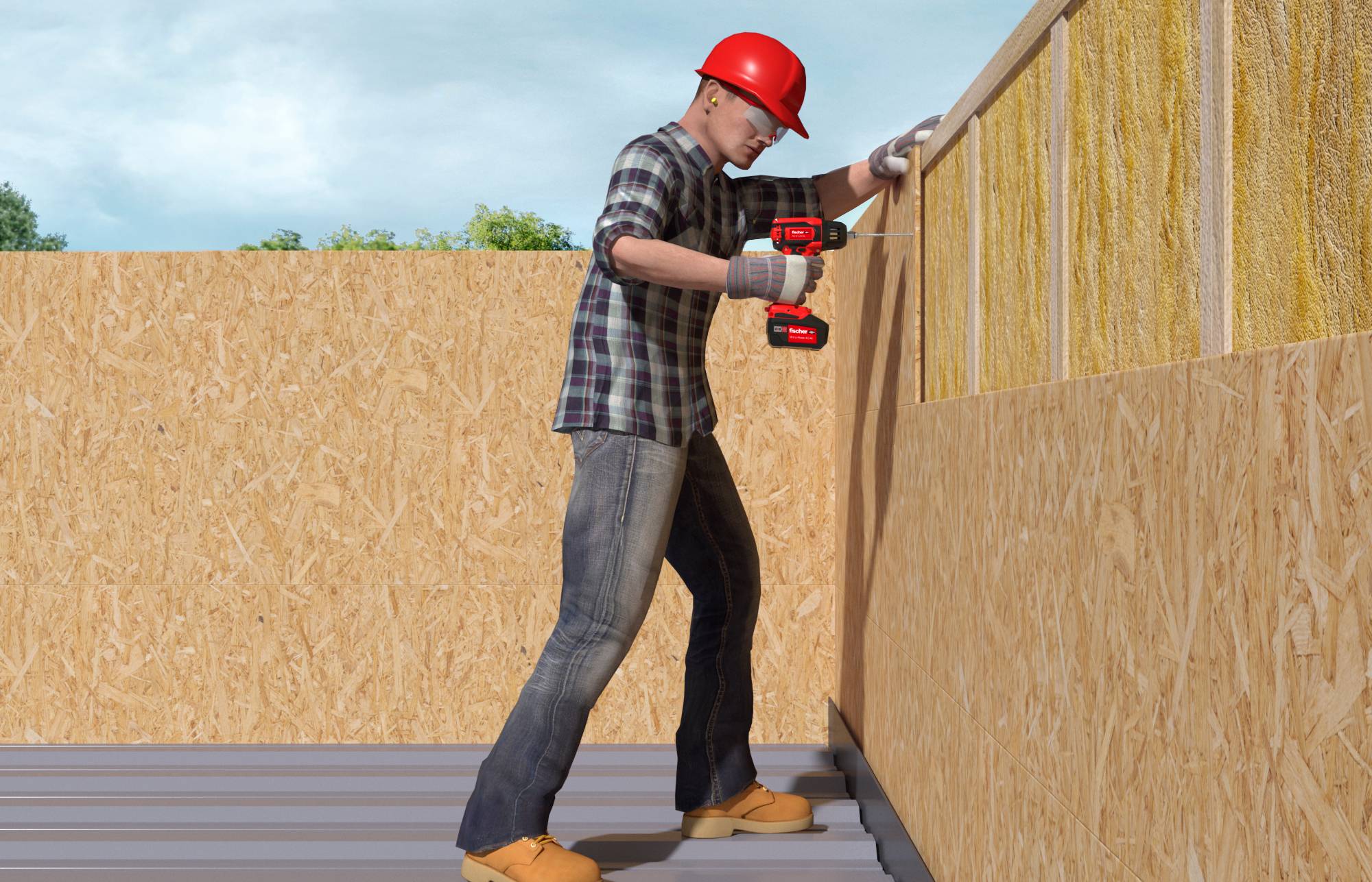 Un ouvrier du bâtiment portant un casque de protection rouge utilise une perceuse électrique pour fixer le contreplaqué de revêtement à une ossature murale sur un chantier de construction.