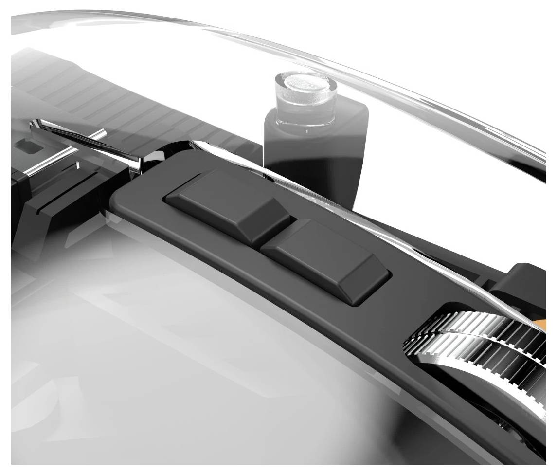 Gros plan d'un composant de véhicule présentant deux boutons rectangulaires sur une surface brillante, avec une partie d'un objet cylindrique visible en arrière-plan.