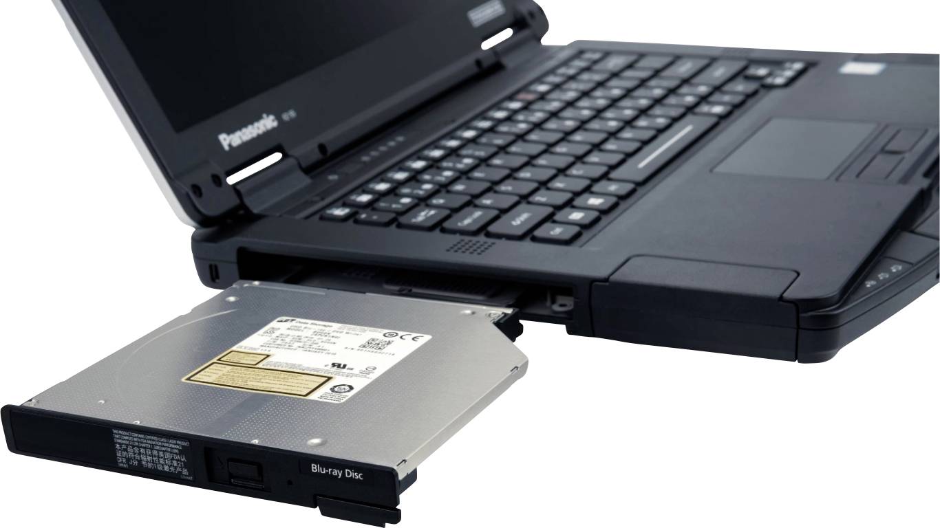 Un ordinateur portable robuste avec un lecteur DVD retiré. L'ordinateur portable est partiellement ouvert et montre un design robuste pour une utilisation dans des environnements difficiles.