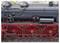 Vue rapprochée d'une locomotive à vapeur vintage, mettant l'accent sur la chaudière noire détaillée et les roues rouges.