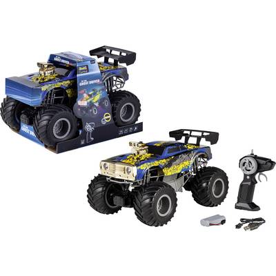 Camion monstre télécommandé au design bleu et jaune, présenté avec son emballage, sa batterie, son chargeur et sa télécommande à proximité.