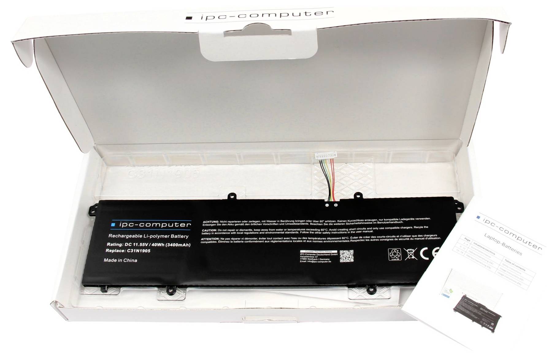 Batterie d'ordinateur portable dans un boîtier avec des fils apparents, étiquette indiquant le modèle et les spécifications, à côté d'une notice d'instructions.