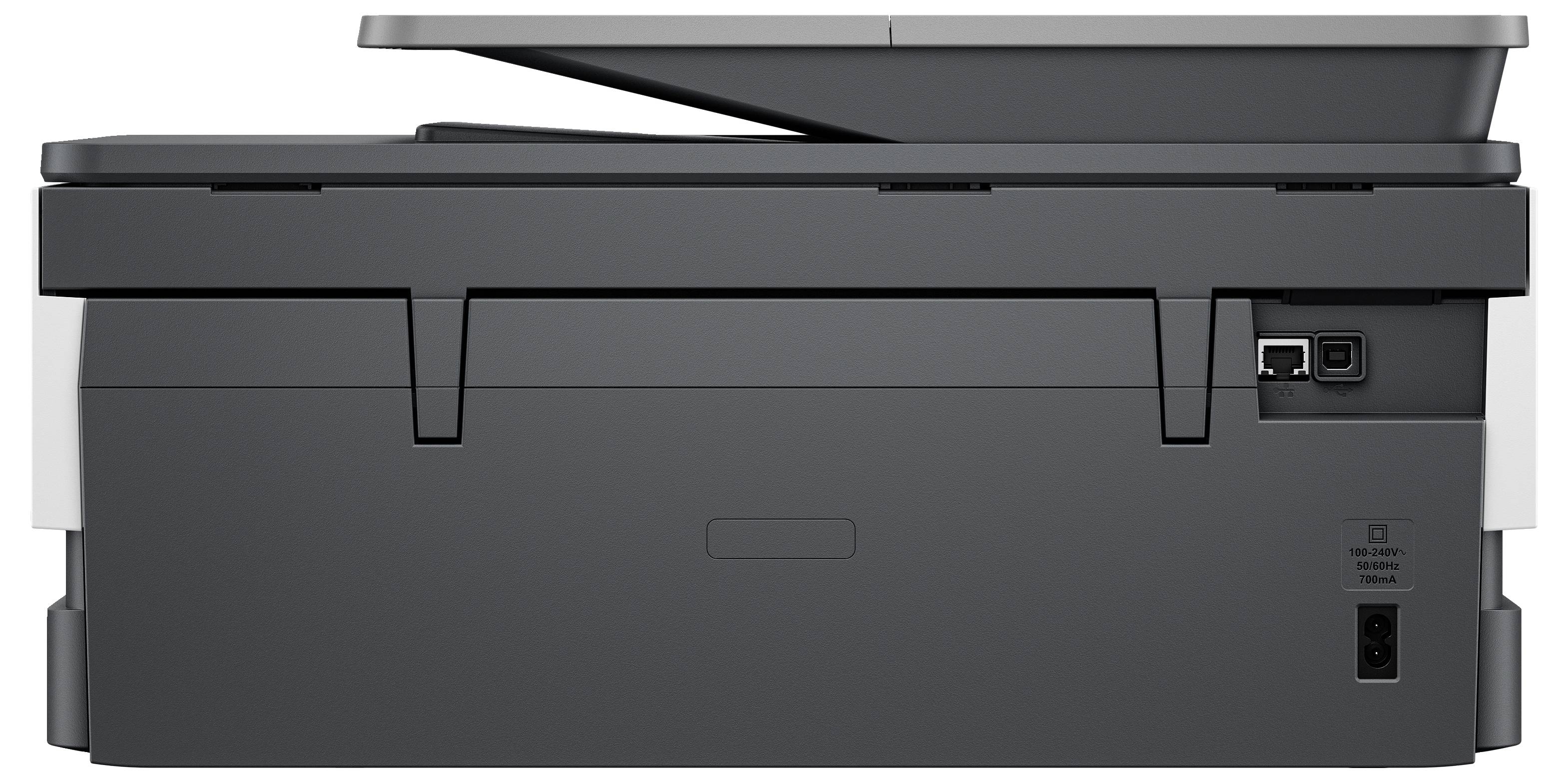 Une imprimante multifonction noire avec un scanner à plat, des ports USB et Ethernet visibles à l'arrière.