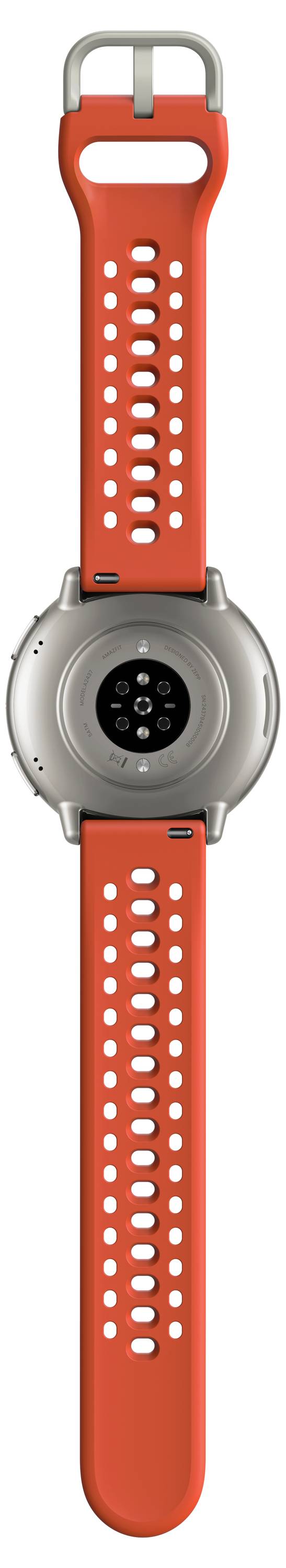 Une montre connectée avec un cadran rond argenté et un bracelet rouge perforé, conçue pour le suivi de la condition physique et la surveillance de la santé.