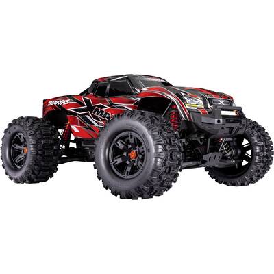 Un camion monstre télécommandé rouge et noir avec des pneus larges et détaillés, présentant un design robuste pour une utilisation tout-terrain.