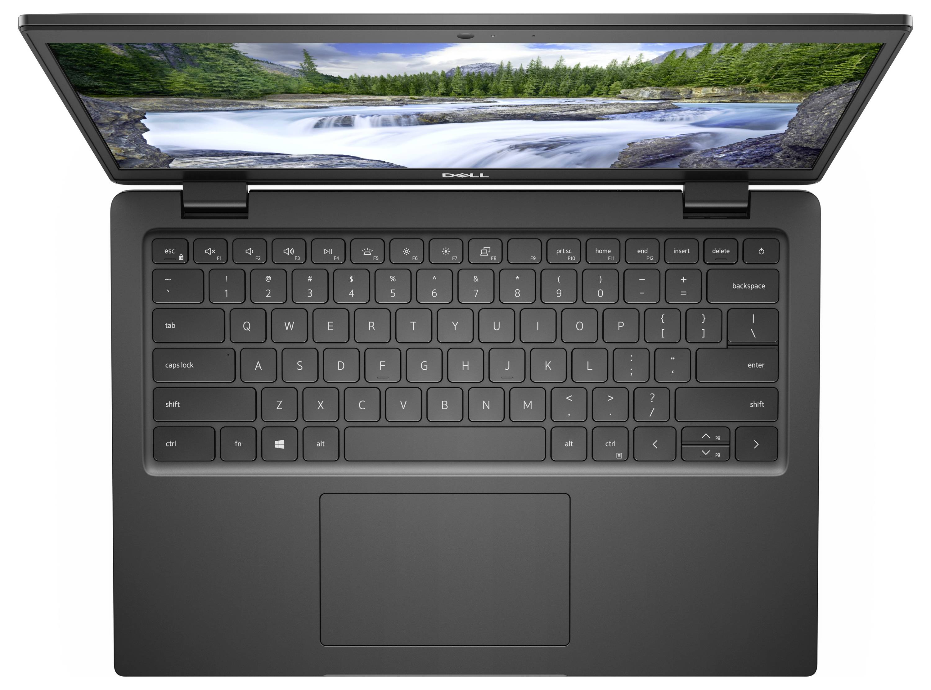 Ordinateur portable Dell ouvert, avec un paysage de montagne à l'écran, vu de dessus. Le clavier et le pavé tactile sont visibles.