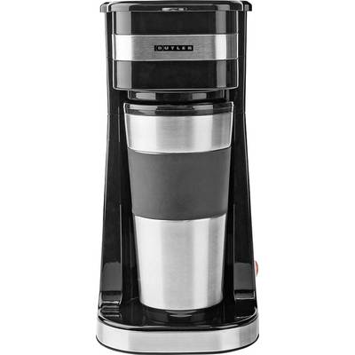 Machine à café à dosette avec une tasse de voyage en acier inoxydable sur un socle noir et argenté.