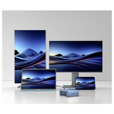Une variété d'appareils électroniques affichant un motif ondulé unifié bleu et noir, comprenant un moniteur, une tablette et un smartphone.