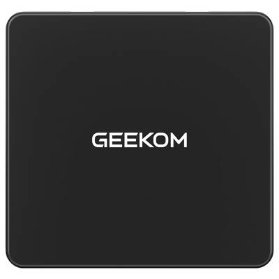 Un appareil électronique noir portant l'étiquette « GEEKOM » centrée sur sa surface.