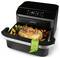 Un air fryer à double zone avec un rôti et des légumes à l'intérieur, doté d'un panneau de contrôle numérique et de compartiments étiquetés : « Zone XXL 10 litres, Double Zone 5L + 5L ».