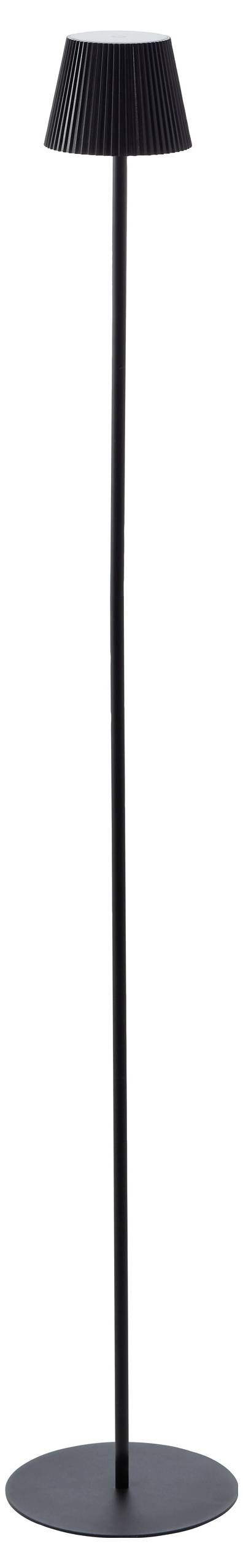 Une lampe sur pied noire, élancée et haute, dotée d'un abat-jour plissé, reposant verticalement sur une base ronde.