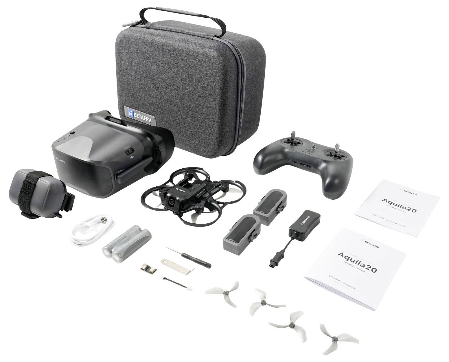 Un kit de drone disposé avec un étui rigide, un casque, une télécommande, des batteries, des câbles, des hélices, des outils et des manuels d'instruction sur un fond blanc.