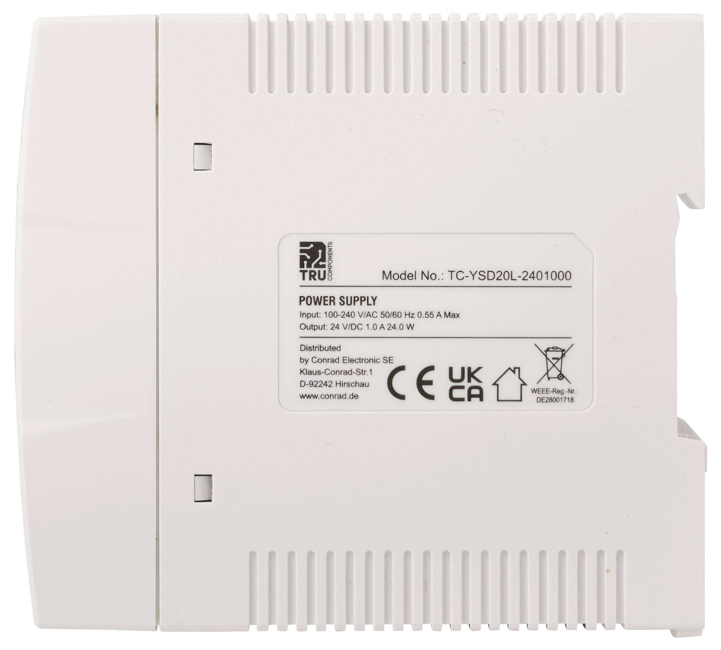 Unité d'alimentation électrique TRU blanche avec étiquette montrant le modèle TC-YSD20L-2401000 et une sortie de 24V DC, 1.0A, 24.0W.