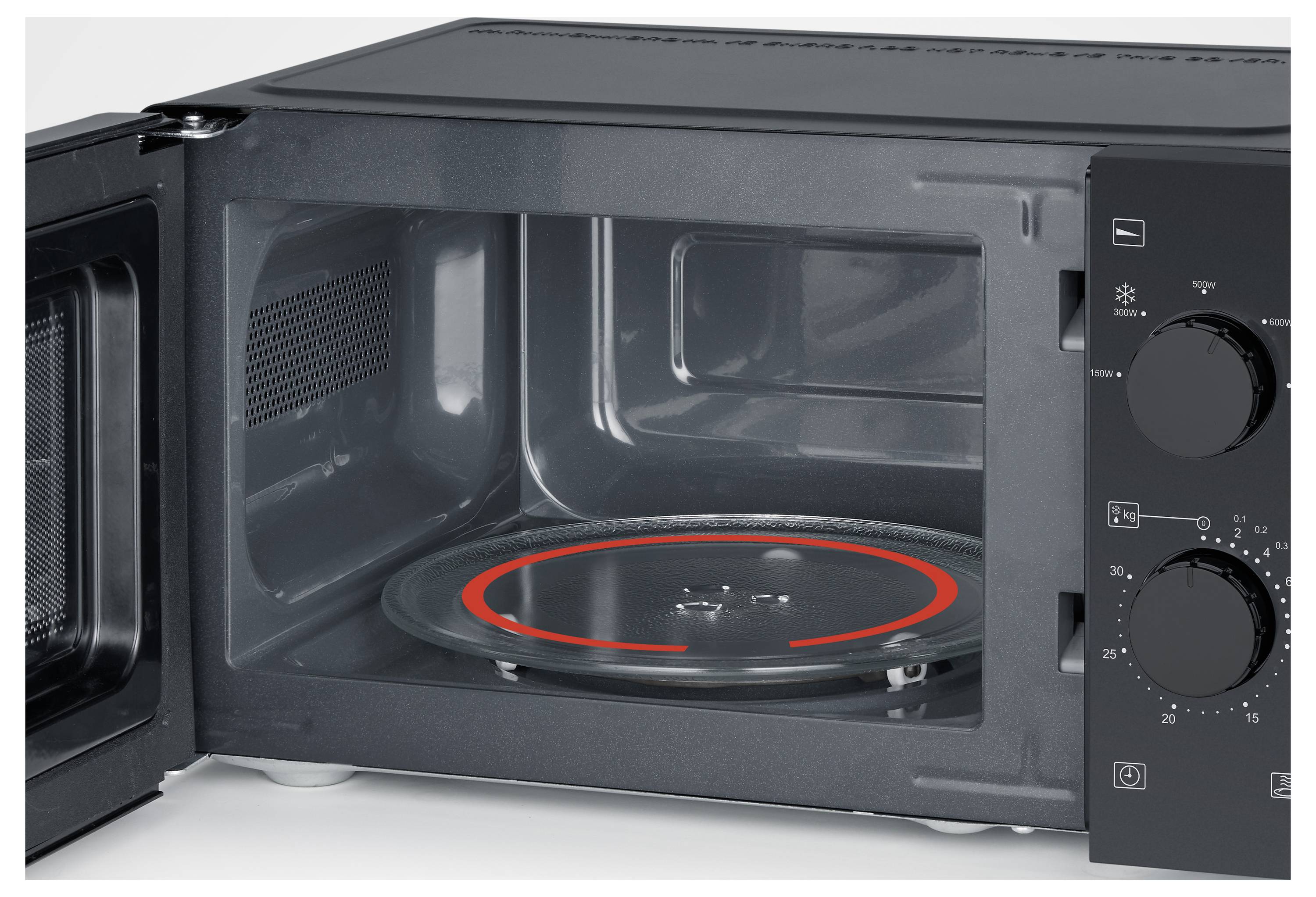 Un four à micro-ondes ouvert avec un plateau en verre rotatif à l'intérieur et deux cadrans de commande sur le côté droit pour ajuster les paramètres.