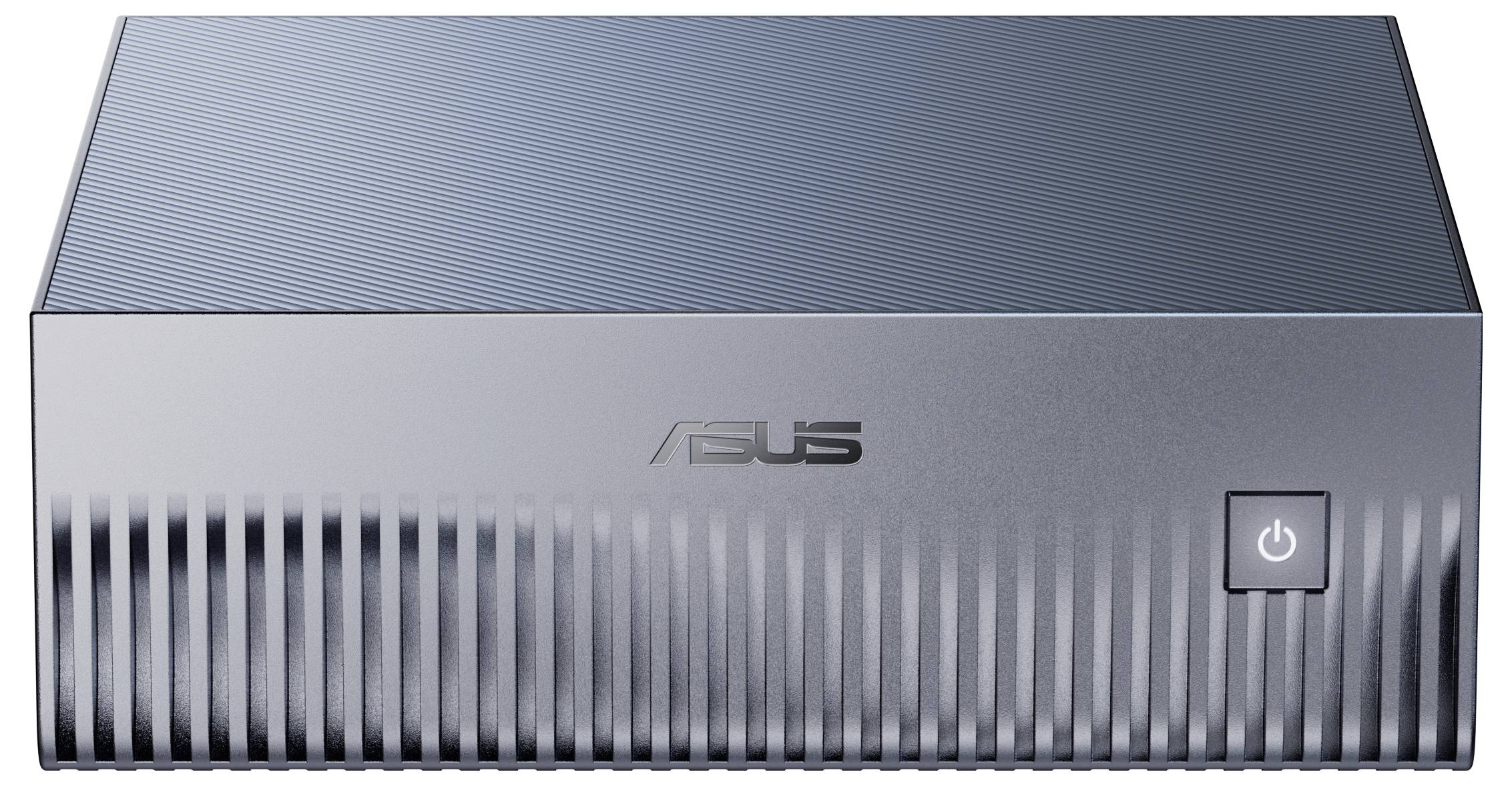 'Mini PC ASUS couleur argent avec un bouton d'alimentation à l'avant, présentant un design avec grille texturée.'