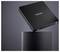 Disque dur externe de marque « Intenso » lévitant au-dessus d'un socle rond sur un fond sombre.
