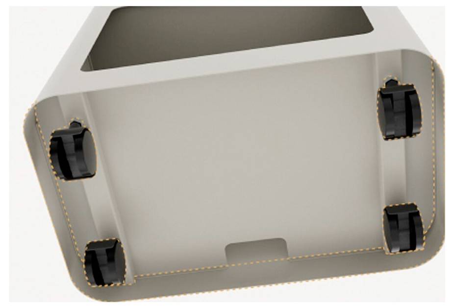 Vue de dessous d'un objet rectangulaire avec quatre petites roues noires à chaque coin, ce qui indique probablement qu'il est conçu pour être mobile.