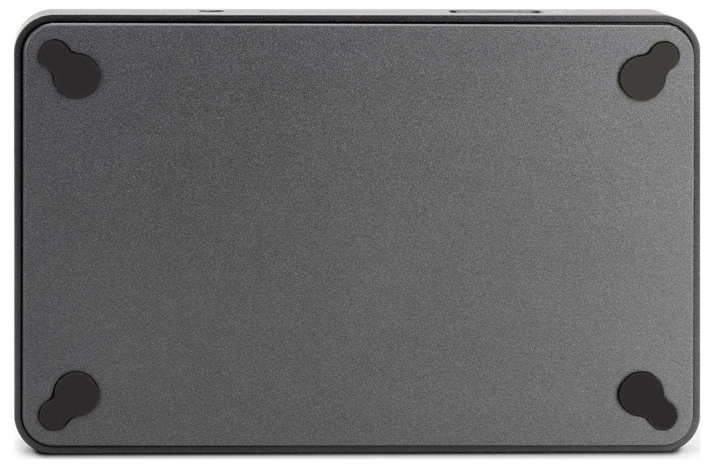 Un appareil rectangulaire noir avec quatre pieds en caoutchouc sur le dessous pour la stabilité.