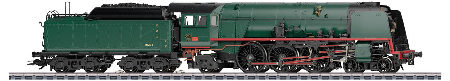 Une locomotive à vapeur verte avec des détails rouges et des accents noirs exposée, mettant en avant la conception classique de l'ingénierie.