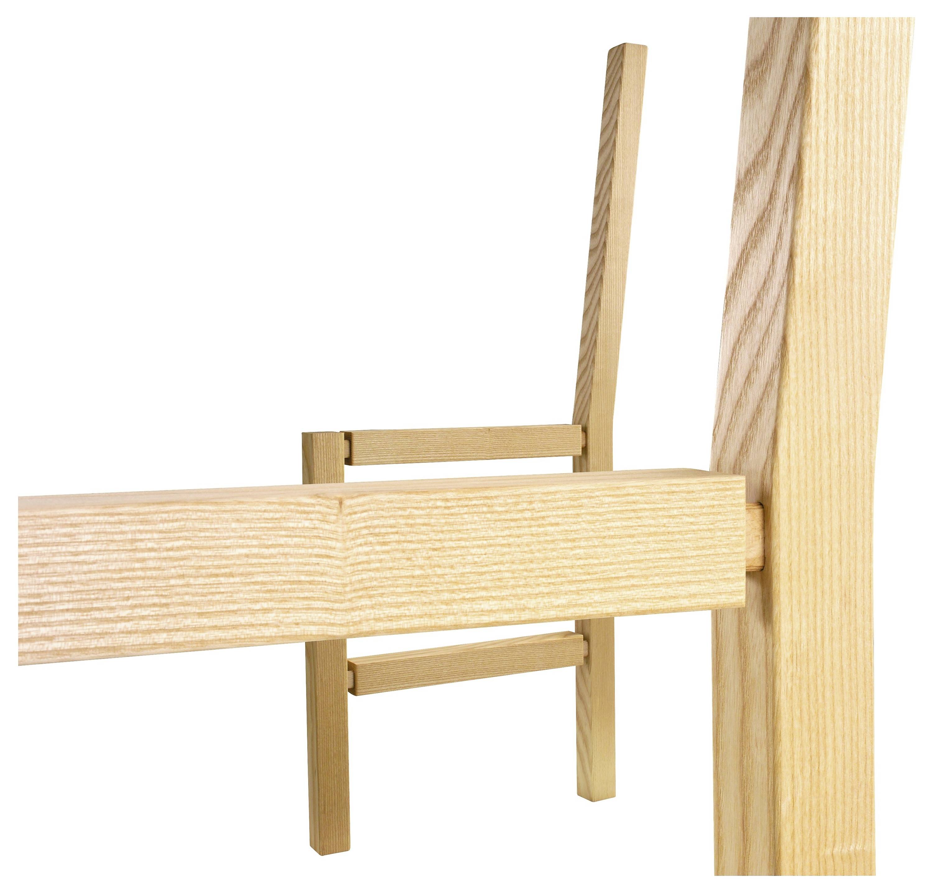 Image rapprochée de pièces de chaise en bois montrant l'assemblage avec des joints à emboîtement.
