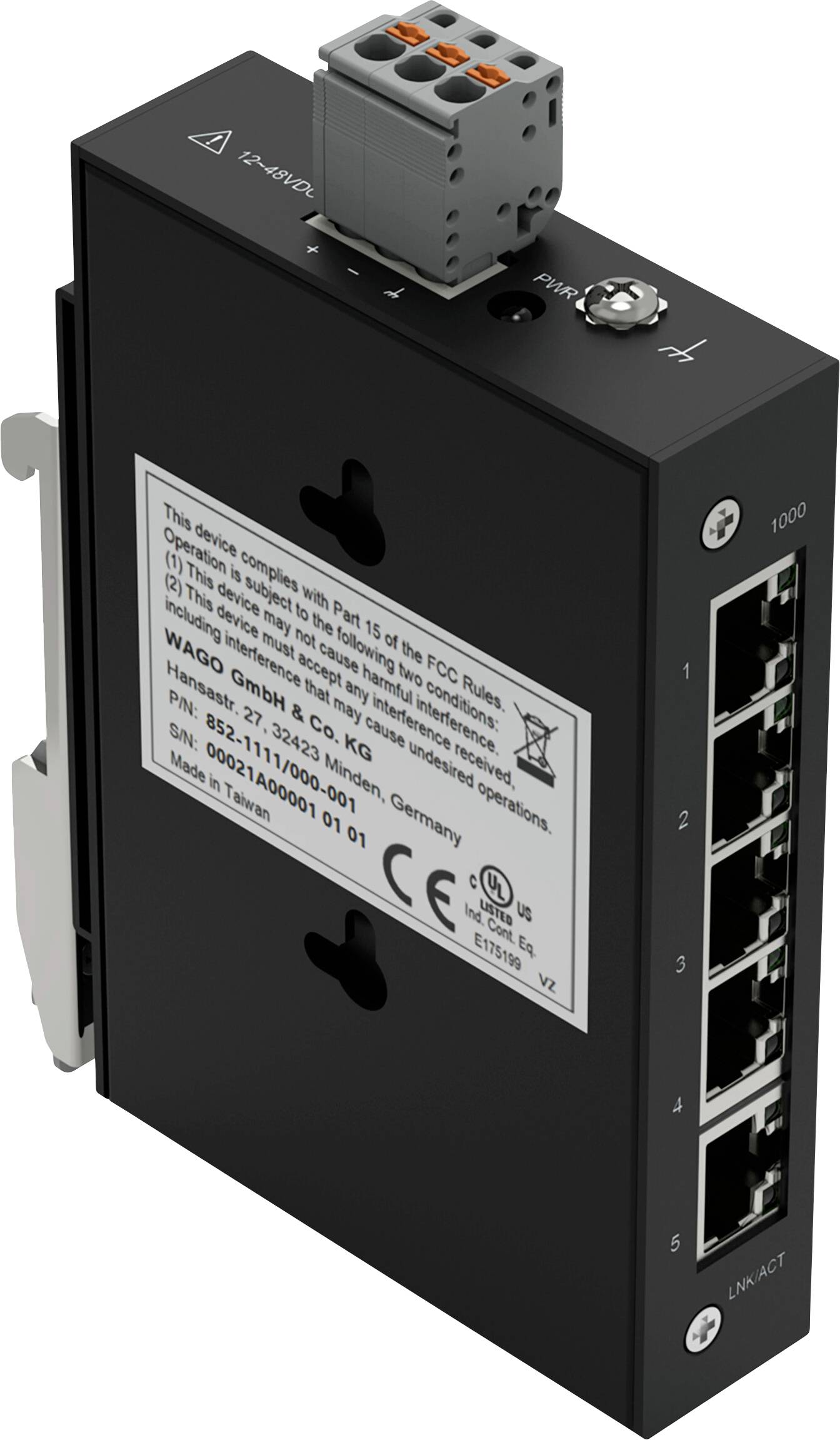 Un commutateur réseau noir avec un connecteur d'alimentation et plusieurs ports Ethernet numérotés de 1 à 4. Il comprend une étiquette de conformité et les détails de l'entreprise.