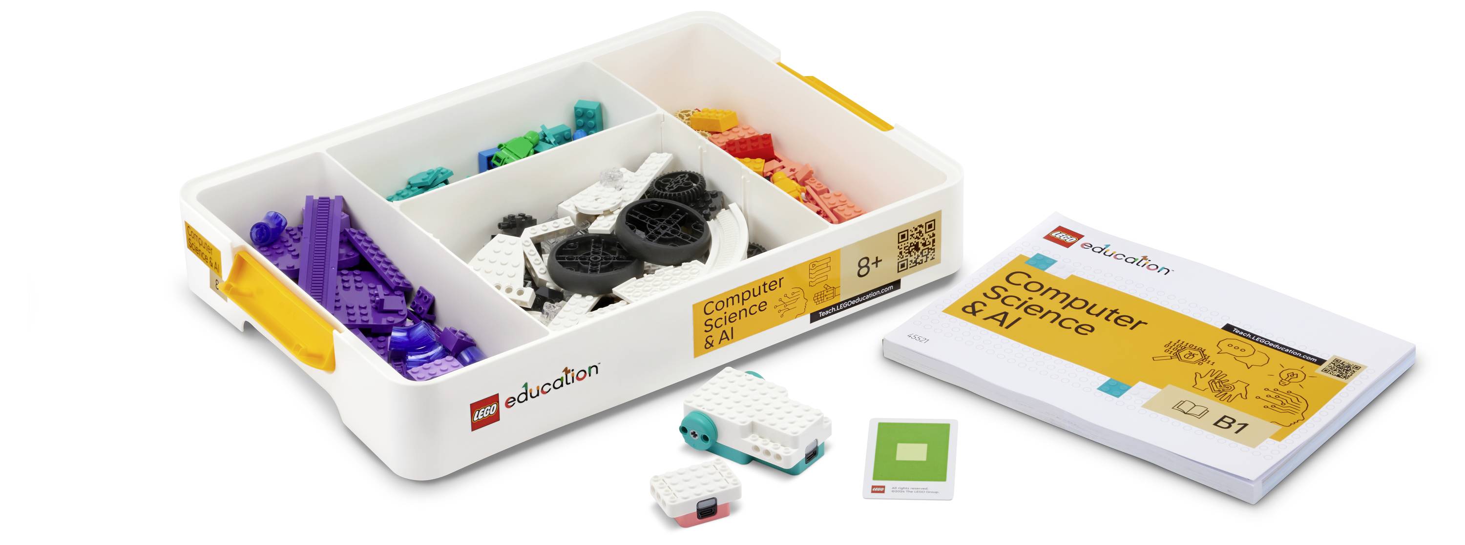 Un kit LEGO Education pour l'Informatique et l'IA, présentant divers blocs, engrenages et un manuel étiqueté « B1 », sur un fond blanc.