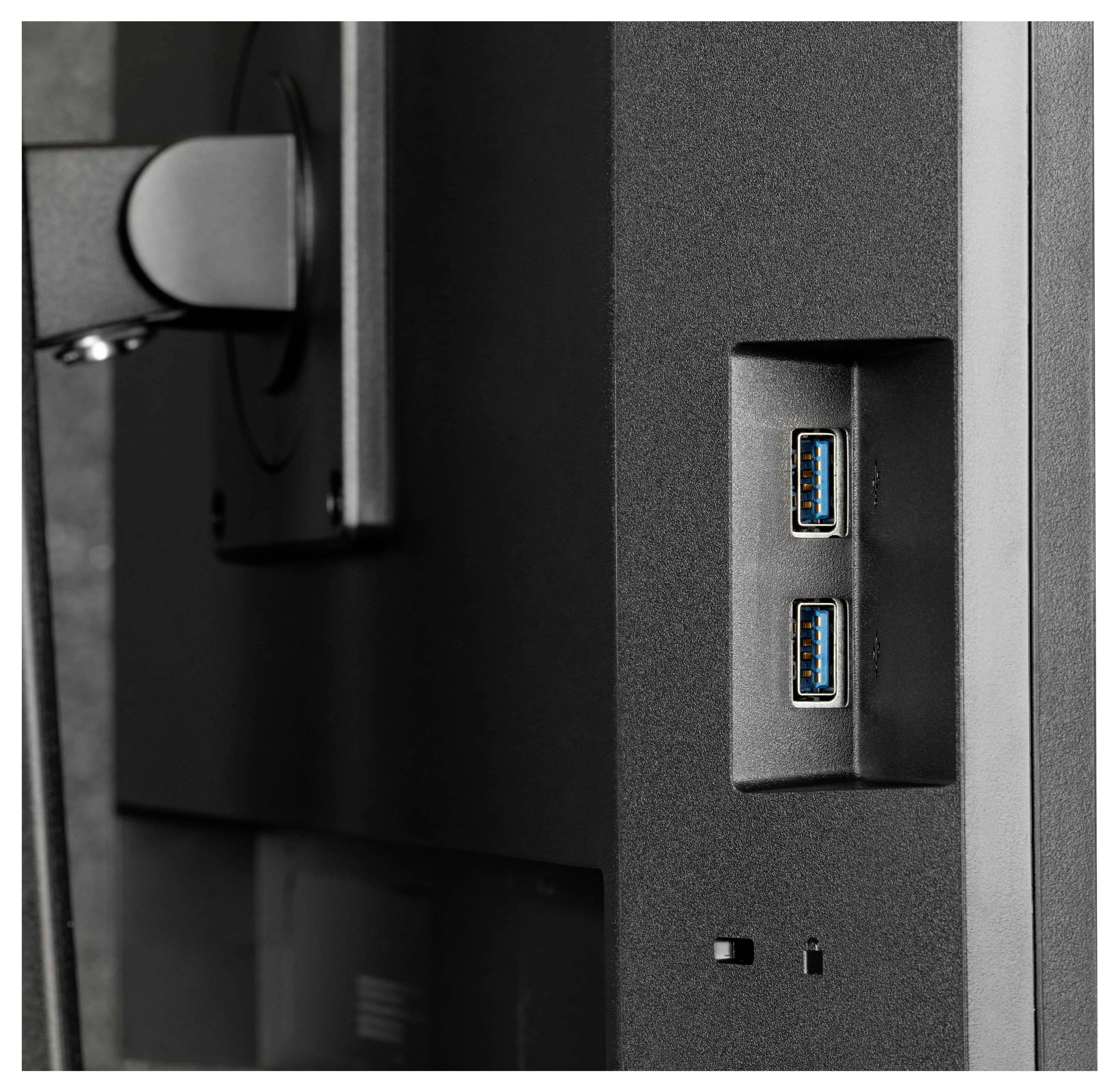 « Vue latérale d'un moniteur avec deux ports USB et une partie du bras de montage visible en arrière-plan. »