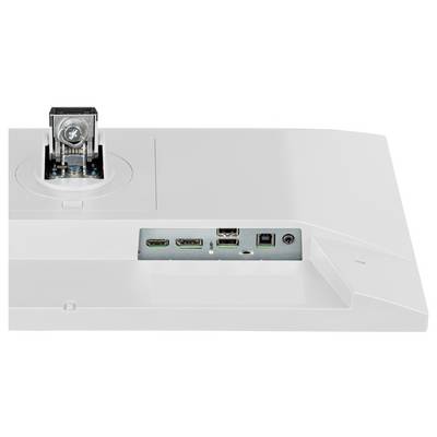 Une vue latérale d'un moniteur informatique noir et élancé sur un pied, montrant son profil fin et les fentes de ventilation sur le panneau arrière.