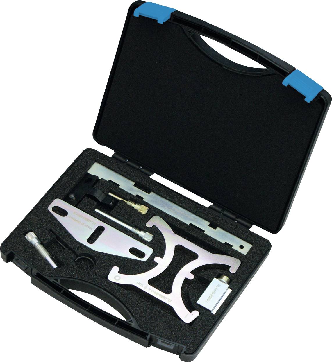 Une mallette à outils noire contenant divers outils et composants métalliques de précision disposés dans une mousse, destinée à l'entretien du calage moteur.