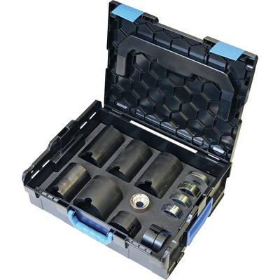 Un étui de rangement noir et bleu ouvert révélant des outils métalliques circulaires de différentes tailles, organisés dans des découpes en mousse.