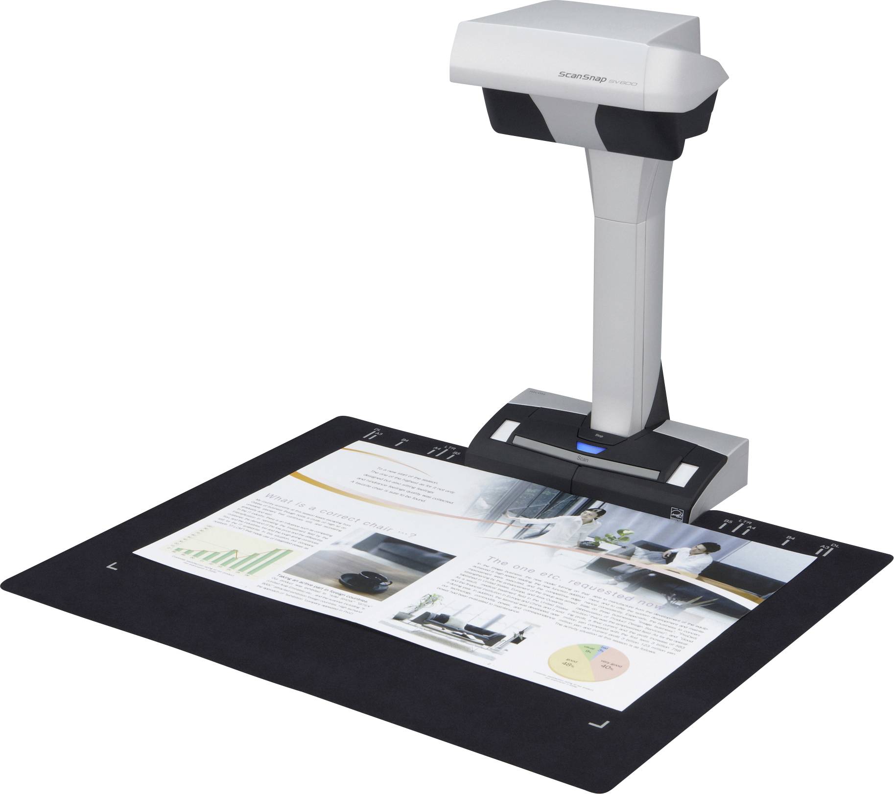 Un scanner de documents capturant une page de magazine avec des graphiques et des images sur un tapis noir.