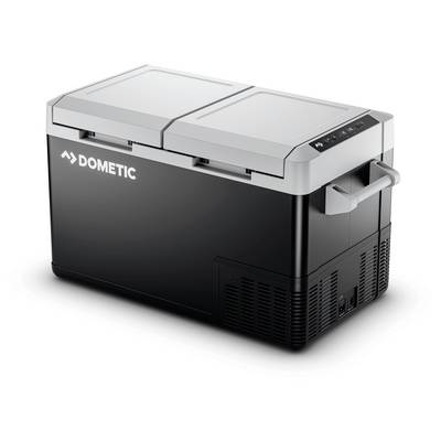 Un refroidisseur électrique portable Dometic noir avec un couvercle gris à charnière et des poignées de transport, présenté sur un fond blanc.
