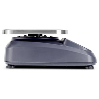 Balance numérique avec une plateforme métallique ronde et plate, vue de profil, montrant une base solide avec des pieds réglables.