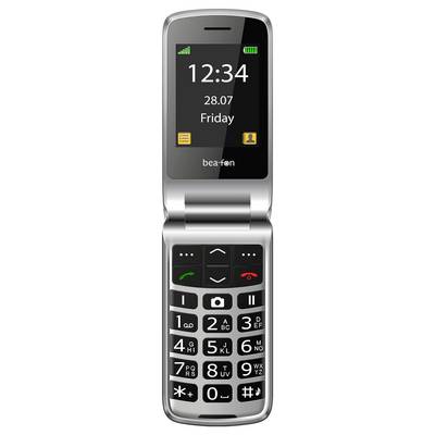 Un téléphone à clapet argenté avec un écran numérique affichant l'heure « 12:34 » et la date « 28.07 vendredi ». En dessous se trouvent de grands boutons physiques.