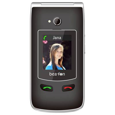 Un téléphone à clapet affichant un contact nommé « Jana » avec une option d'appel. L'écran affiche l'image d'une personne souriante, portant une chemise bleue.