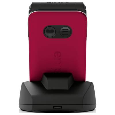 Un téléphone à clapet rouge avec deux objectifs d'appareil photo repose sur un socle de chargement noir, montrant clairement la vue arrière.