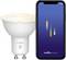 Smartphone affichant l'application « nordlux smart » à côté d'une ampoule LED intelligente avec logo Bluetooth, indiquant le contrôle de l'éclairage intelligent via l'application.