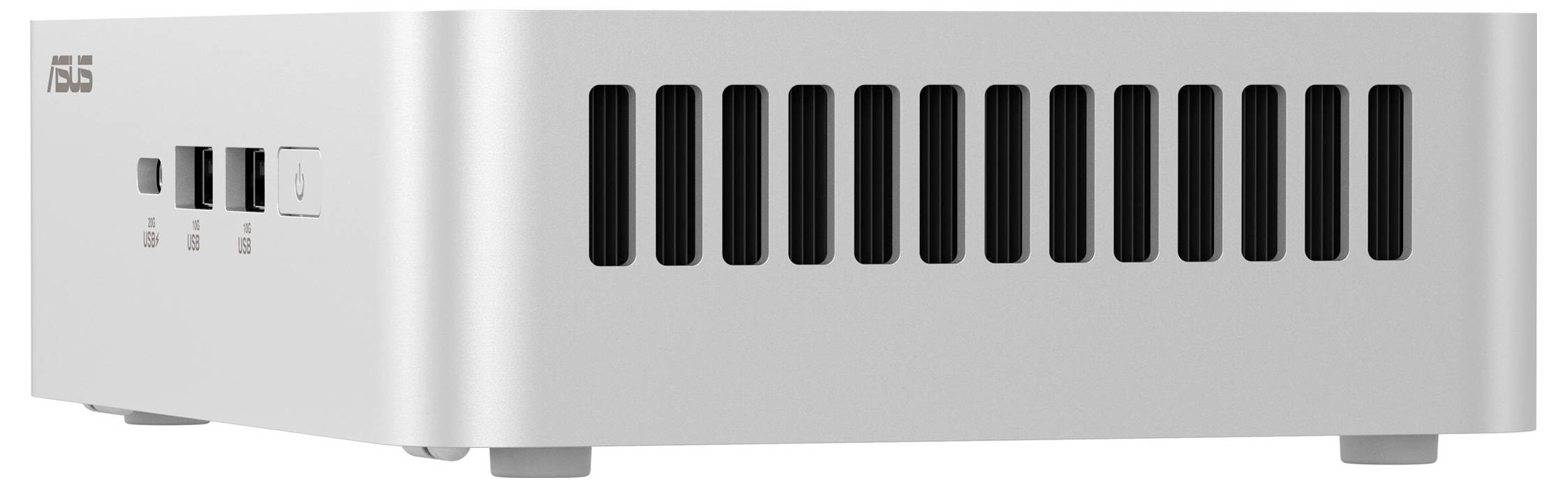 Un mini PC ASUS en argent avec des fentes de ventilation et des ports USB sur la face avant.