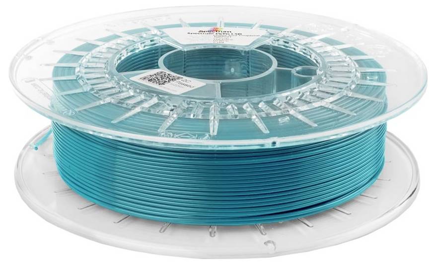Bobine de filament pour imprimante 3D turquoise sur une bobine en plastique transparent sur fond blanc.