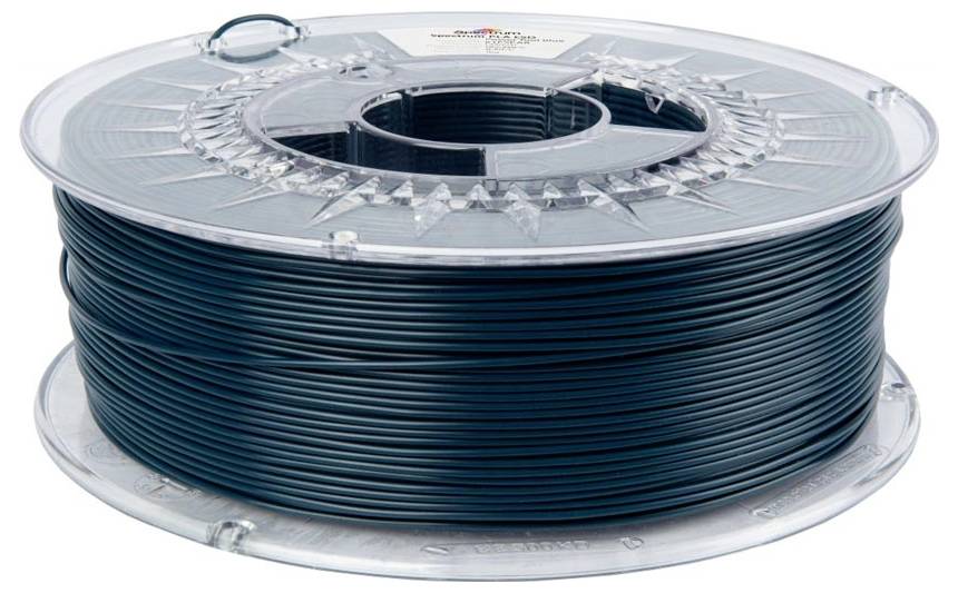 Bobine de filament d'impression 3D bleu foncé sur une bobine en plastique transparent.