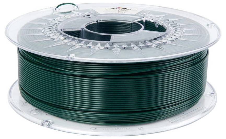 Bobine de filament ou de fil vert foncé enroulé sur une bobine en plastique transparent, isolée sur un fond blanc.