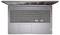 Vue de dessus d'un ordinateur portable ouvert avec un clavier gris, un pavé tactile et la charnière d'écran visible, affichant un bureau avec des icônes d'applications.
